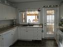 5050 56 Street, Lacombe, AB  - Indoor Photo Showing Kitchen With Double Sink 