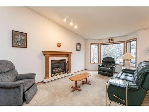 72 Hathaway Lane, Lacombe, AB - Indoor Photo Showing Living Room With Fireplace