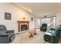 72 Hathaway Lane, Lacombe, AB  - Indoor Photo Showing Living Room With Fireplace 