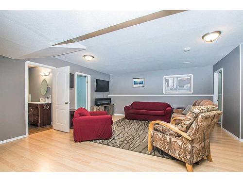 16 Duval Close, Red Deer, AB - Indoor Photo Showing Other Room With Fireplace