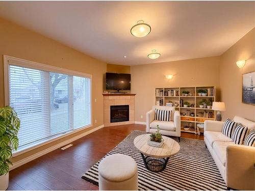 #2-5117 54 Avenue, Ponoka, AB - Indoor Photo Showing Living Room With Fireplace