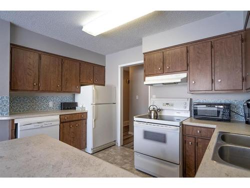 6103 50A, Stettler, AB - Indoor Photo Showing Kitchen With Double Sink