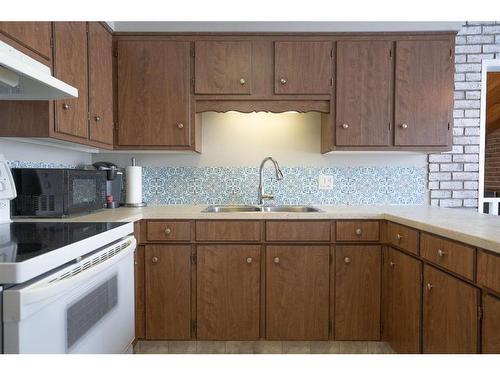 6103 50A, Stettler, AB - Indoor Photo Showing Kitchen With Double Sink