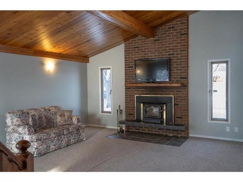 6103 50A, Stettler, AB - Indoor Photo Showing Living Room With Fireplace