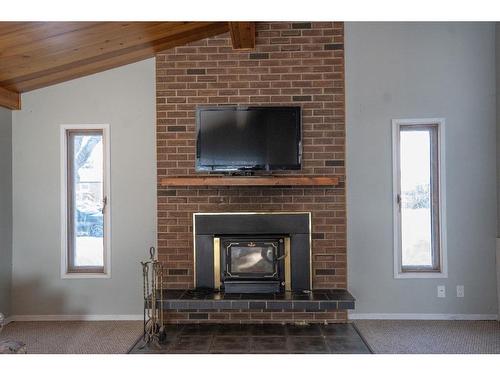 6103 50A, Stettler, AB - Indoor Photo Showing Living Room With Fireplace