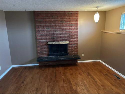 47 Mitchell Avenue, Red Deer, AB - Indoor With Fireplace