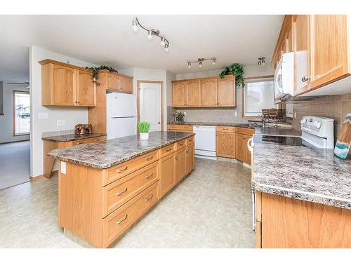 36 Burris Pointe, Lacombe, AB - Indoor Photo Showing Kitchen With Double Sink