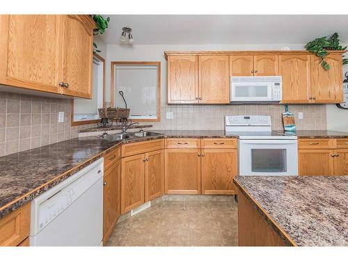 36 Burris Pointe, Lacombe, AB - Indoor Photo Showing Kitchen With Double Sink