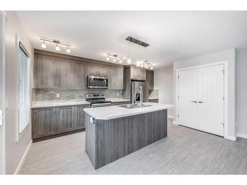 32 Ellington Crescent, Red Deer, AB - Indoor Photo Showing Kitchen With Double Sink With Upgraded Kitchen