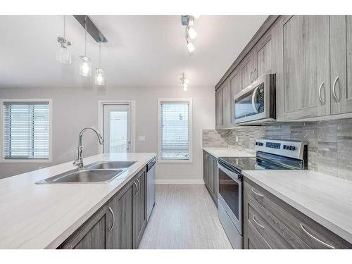 32 Ellington Crescent, Red Deer, AB - Indoor Photo Showing Kitchen With Double Sink With Upgraded Kitchen