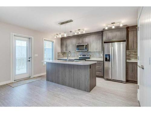 32 Ellington Crescent, Red Deer, AB - Indoor Photo Showing Kitchen With Stainless Steel Kitchen With Upgraded Kitchen