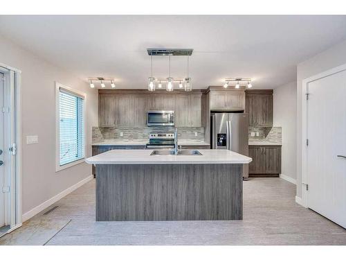 32 Ellington Crescent, Red Deer, AB - Indoor Photo Showing Kitchen With Stainless Steel Kitchen With Double Sink