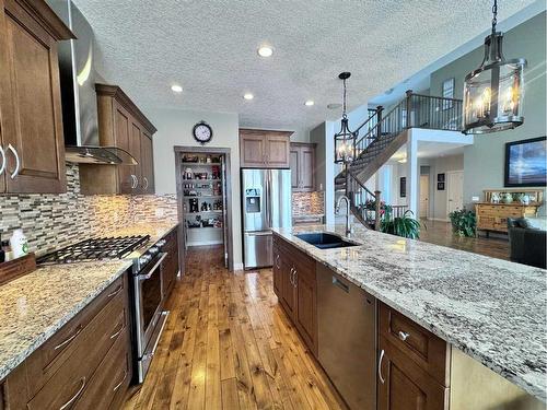 37 Drake Landing Ridge, Okotoks, AB - Indoor Photo Showing Kitchen With Double Sink With Upgraded Kitchen