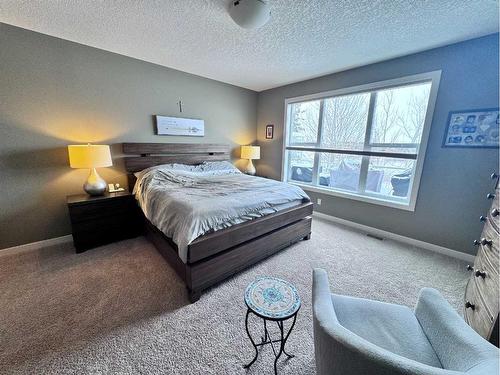 37 Drake Landing Ridge, Okotoks, AB - Indoor Photo Showing Bedroom