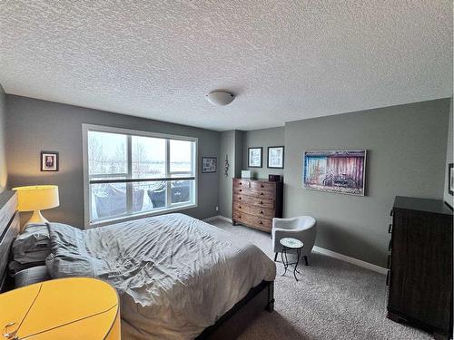 37 Drake Landing Ridge, Okotoks, AB - Indoor Photo Showing Bedroom