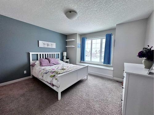 37 Drake Landing Ridge, Okotoks, AB - Indoor Photo Showing Bedroom