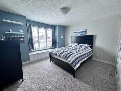 37 Drake Landing Ridge, Okotoks, AB - Indoor Photo Showing Bedroom