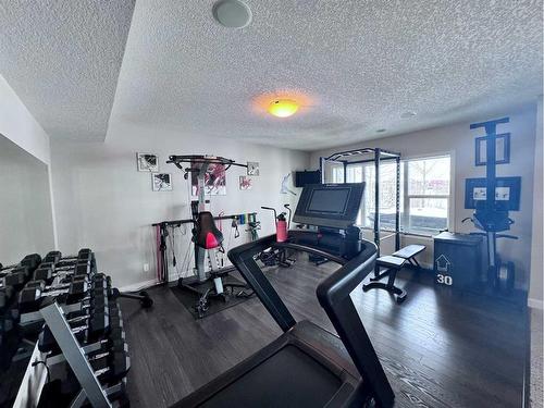 37 Drake Landing Ridge, Okotoks, AB - Indoor Photo Showing Gym Room