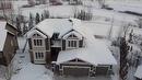 37 Drake Landing Ridge, Okotoks, AB  - Outdoor With Facade 