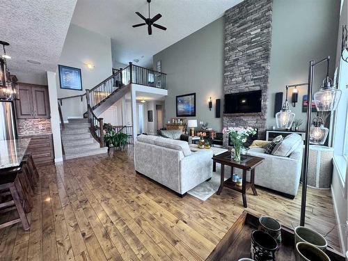 37 Drake Landing Ridge, Okotoks, AB - Indoor Photo Showing Living Room With Fireplace