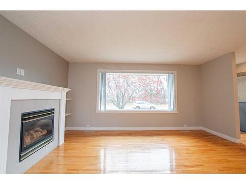 113 Selkirk Boulevard, Red Deer, AB - Indoor Photo Showing Living Room With Fireplace