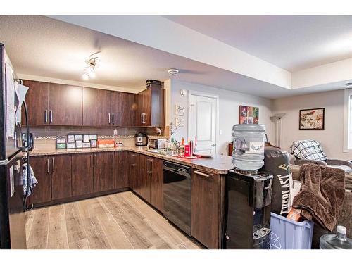 204-639 Oak Street, Springbrook, AB - Indoor Photo Showing Kitchen With Double Sink