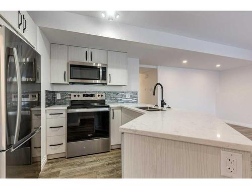 5032 59 Street, Innisfail, AB - Indoor Photo Showing Kitchen With Stainless Steel Kitchen With Double Sink With Upgraded Kitchen