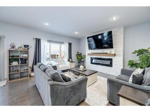 73 Chinook Street, Blackfalds, AB - Indoor Photo Showing Living Room With Fireplace