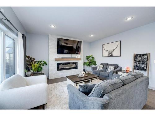 73 Chinook Street, Blackfalds, AB - Indoor Photo Showing Living Room With Fireplace