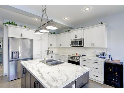 73 Chinook Street, Blackfalds, AB - Indoor Photo Showing Kitchen With Double Sink With Upgraded Kitchen