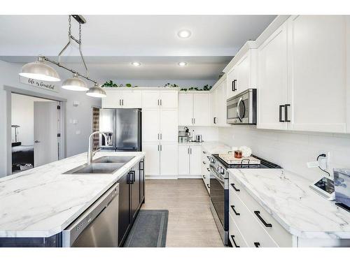 73 Chinook Street, Blackfalds, AB - Indoor Photo Showing Kitchen With Double Sink With Upgraded Kitchen