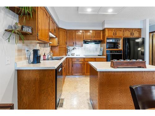 8 Ramsey Close, Red Deer, AB - Indoor Photo Showing Kitchen With Double Sink