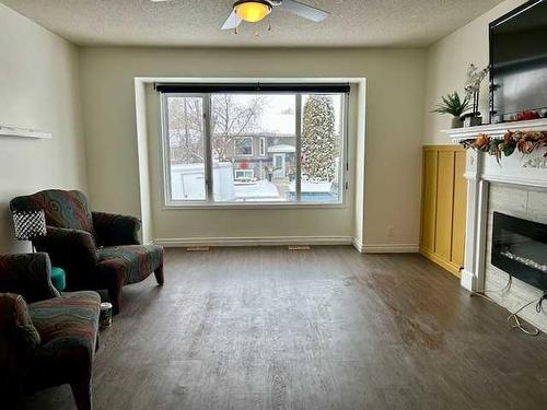 35 Edgington Ave, Red Deer, AB - Indoor Photo Showing Living Room With Fireplace