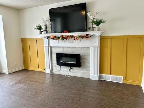 35 Edgington Ave, Red Deer, AB - Indoor Photo Showing Living Room With Fireplace