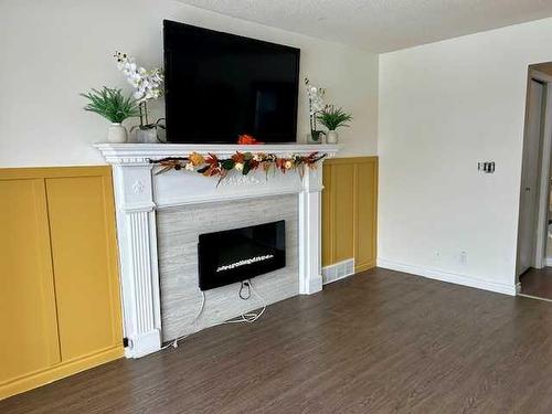 35 Edgington Ave, Red Deer, AB - Indoor Photo Showing Living Room With Fireplace