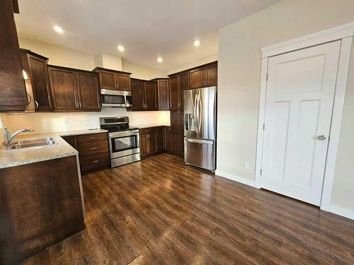 130-116 6 Avenue Ne, Slave Lake, AB - Indoor Photo Showing Kitchen With Double Sink