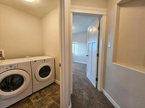 130-116 6 Avenue Ne, Slave Lake, AB - Indoor Photo Showing Laundry Room