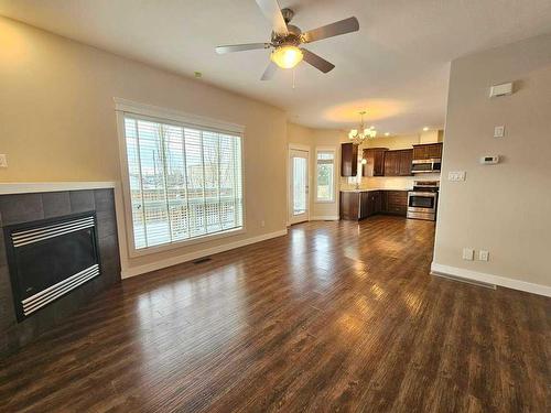 130-116 6 Avenue Ne, Slave Lake, AB - Indoor Photo Showing Living Room With Fireplace