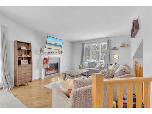 6007 50A Street, Ponoka, AB - Indoor Photo Showing Living Room With Fireplace