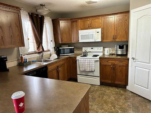 3711 51 Avenue, Red Deer, AB - Indoor Photo Showing Kitchen With Double Sink