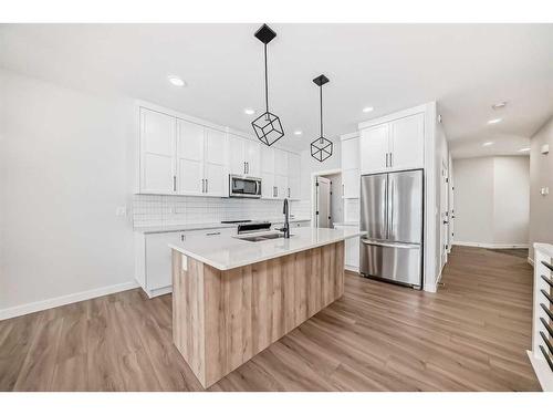 15 Rosse Place, Sylvan Lake, AB - Indoor Photo Showing Kitchen With Stainless Steel Kitchen With Upgraded Kitchen