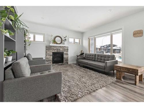 2 Meadow Close, Lacombe, AB - Indoor Photo Showing Living Room With Fireplace