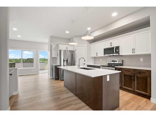 27 Gray Close, Sylvan Lake, AB - Indoor Photo Showing Kitchen With Upgraded Kitchen