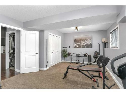 2 Coachman Way, Blackfalds, AB - Indoor Photo Showing Gym Room