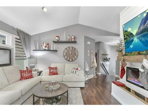 2 Coachman Way, Blackfalds, AB - Indoor Photo Showing Living Room With Fireplace