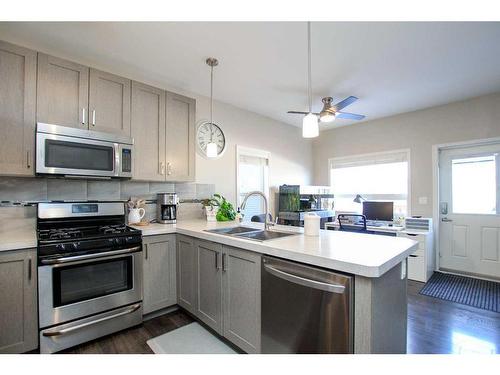 101 Crimson Court, Blackfalds, AB - Indoor Photo Showing Kitchen With Double Sink