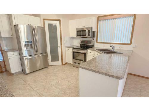 45 Kingston Drive, Red Deer, AB - Indoor Photo Showing Kitchen With Stainless Steel Kitchen With Double Sink