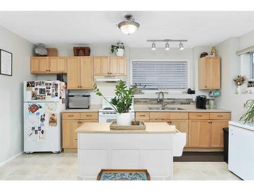 5321 58 Street, Lacombe, AB - Indoor Photo Showing Kitchen With Double Sink