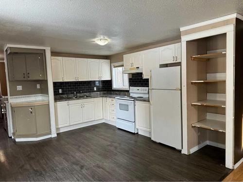 5208 3Rd Avenue East, Boyle, AB - Indoor Photo Showing Kitchen With Double Sink