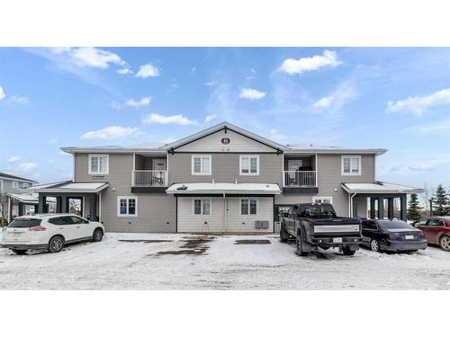 #103-44 Reid Court, Sylvan Lake, AB - Outdoor With Facade